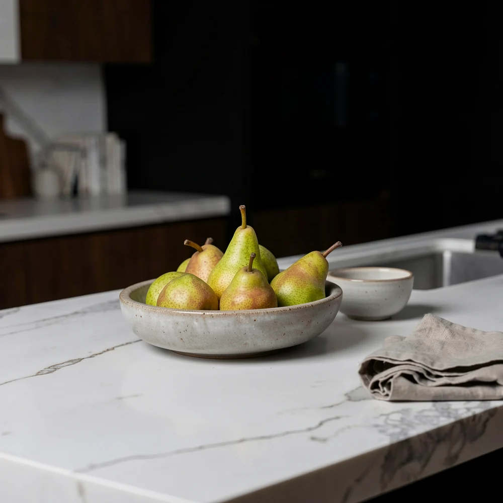 Detail: pears in a bowl on the marble island